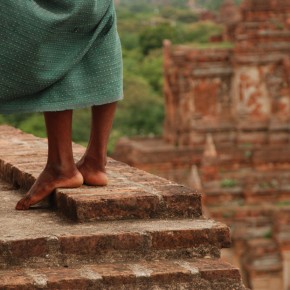 burma20 The flowing longyi of a souvenir seller stalking visitors to the vast temple plain at Bagan