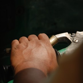 The driver of a CNG, one of the city's demonic fleet of natural gas-powered trishaws